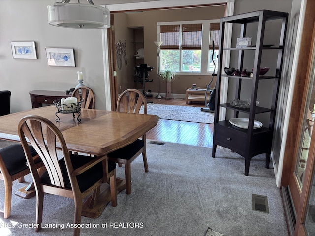 2665 Allium Dr, Holt, MI 48842 - carpeted dining room featuring wood finished floors
