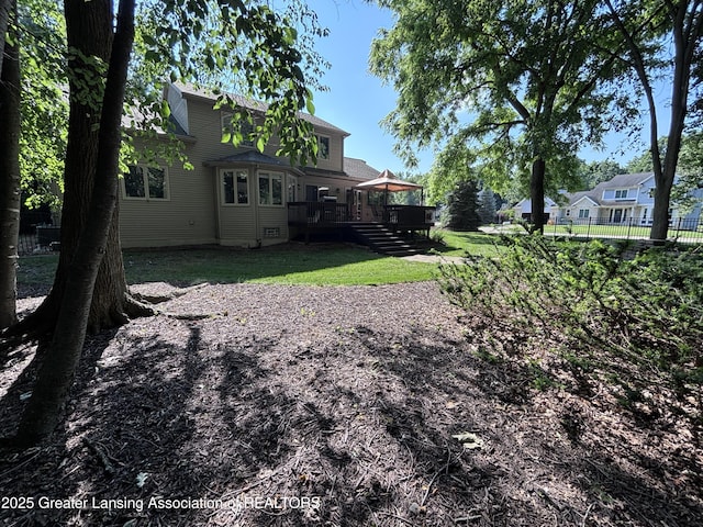 2665 Allium Dr, Holt, MI 48842 - view of yard with a wooden deck and stairway