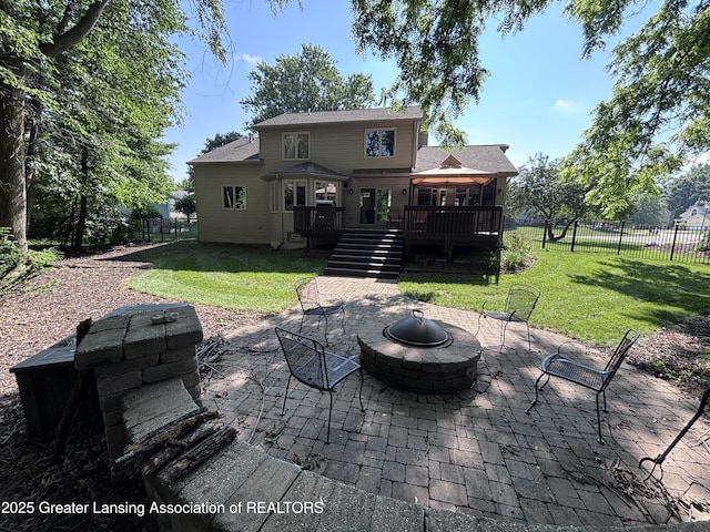 2665 Allium Dr, Holt, MI 48842 - rear view of property with a fire pit, stairway, a patio, a deck, and a fenced backyard