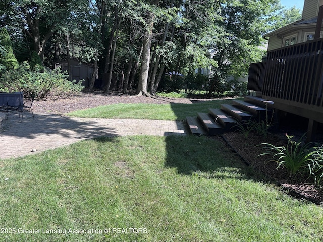 2665 Allium Dr, Holt, MI 48842 - view of green lawn featuring a deck