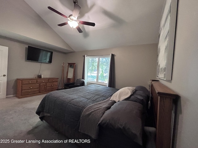 2665 Allium Dr, Holt, MI 48842 - carpeted bedroom with vaulted ceiling and a ceiling fan