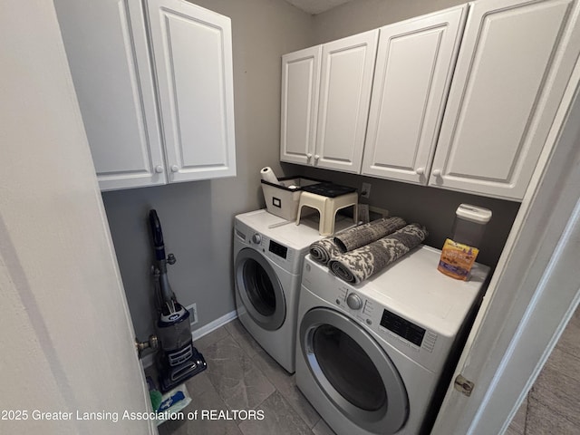 2665 Allium Dr, Holt, MI 48842 - laundry area with independent washer and dryer, cabinet space, and marble finish floors