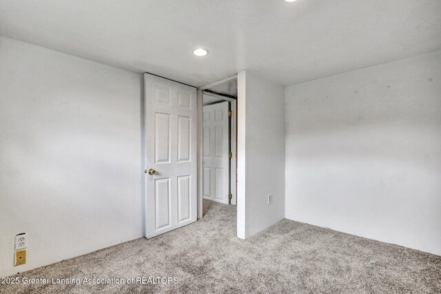 321 Lamb St, Perry, MI 48872 - unfurnished bedroom featuring carpet flooring and recessed lighting