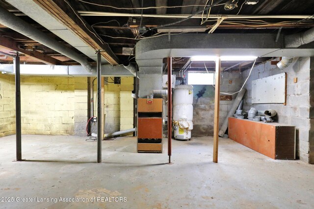 321 Lamb St, Perry, MI 48872 - below grade area featuring water heater
