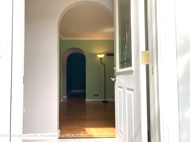500 Spring St, Grand Ledge, MI 48837 - corridor with arched walkways, crown molding, and wood finished floors