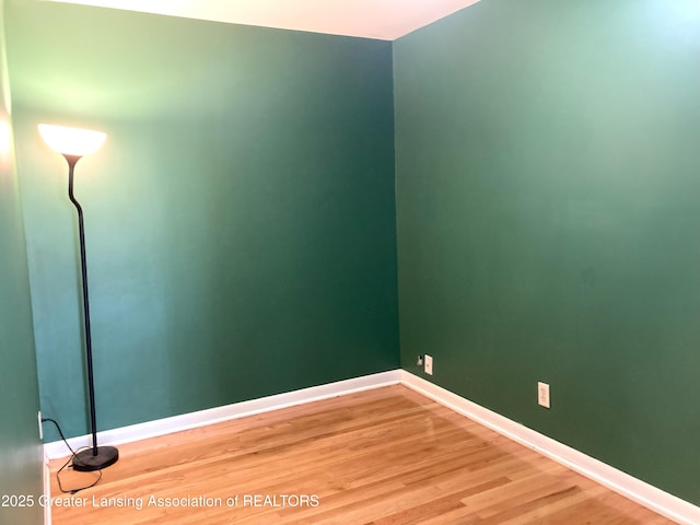 500 Spring St, Grand Ledge, MI 48837 - spare room with light wood-style floors and baseboards