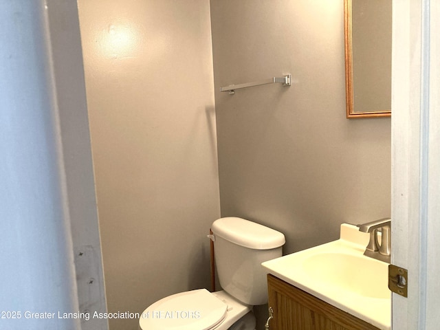 500 Spring St, Grand Ledge, MI 48837 - half bathroom with vanity and toilet