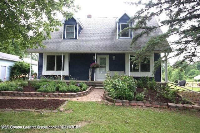 10996 Benton Rd, Grand Ledge, MI 48837 - cape cod house with covered porch, a front yard, and roof with shingles
