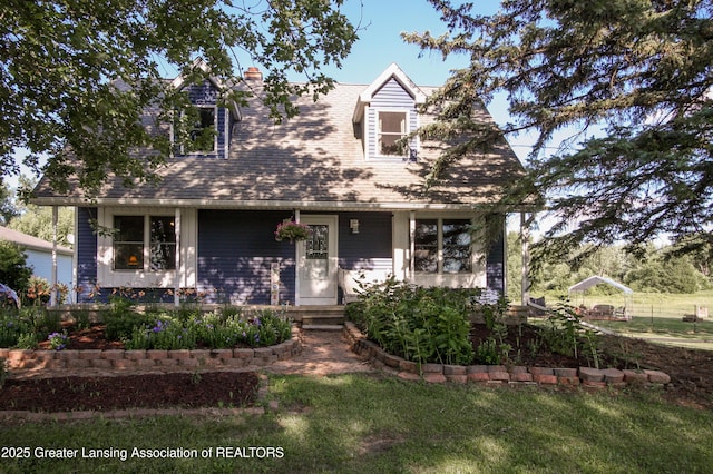 10996 Benton Rd, Grand Ledge, MI 48837 - cape cod home with a front lawn