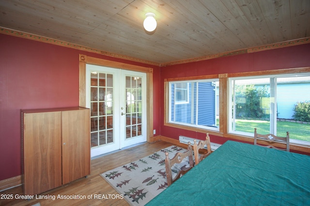 10996 Benton Rd, Grand Ledge, MI 48837 - bedroom featuring french doors, a baseboard radiator, wood finished floors, access to outside, and wood ceiling