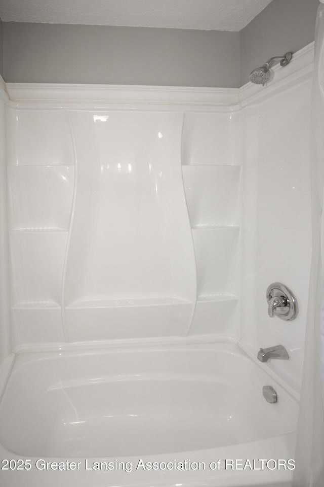 10996 Benton Rd, Grand Ledge, MI 48837 - full bathroom featuring washtub / shower combination