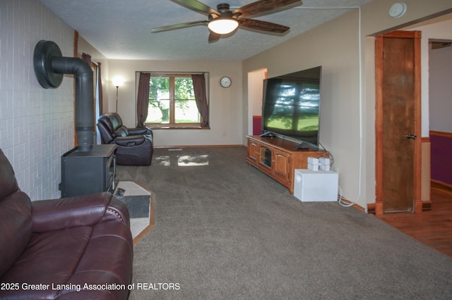 10996 Benton Rd, Grand Ledge, MI 48837 - living area with a wood stove and a ceiling fan