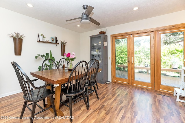 3855 Sandlewood Dr, Okemos, MI 48864 - dining room featuring light wood-style flooring, recessed lighting, ceiling fan, and a textured ceiling
