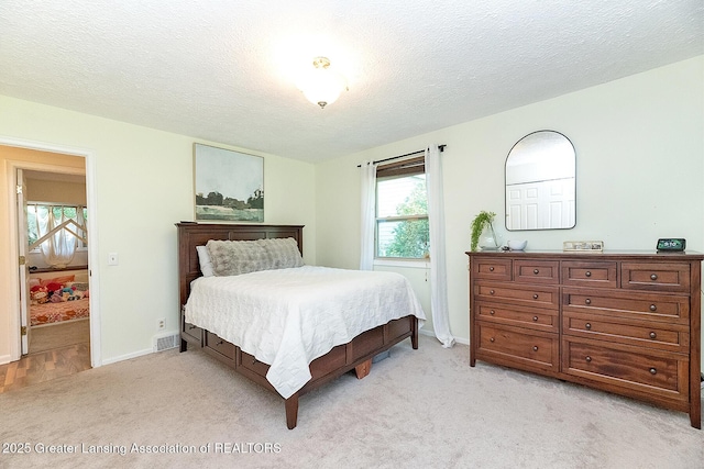 3855 Sandlewood Dr, Okemos, MI 48864 - bedroom featuring light colored carpet and a textured ceiling
