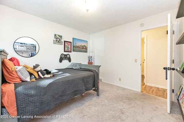 3855 Sandlewood Dr, Okemos, MI 48864 - carpeted bedroom featuring a textured ceiling and baseboards