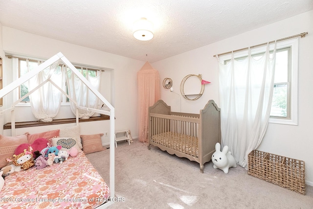 3855 Sandlewood Dr, Okemos, MI 48864 - carpeted bedroom with multiple windows and a textured ceiling
