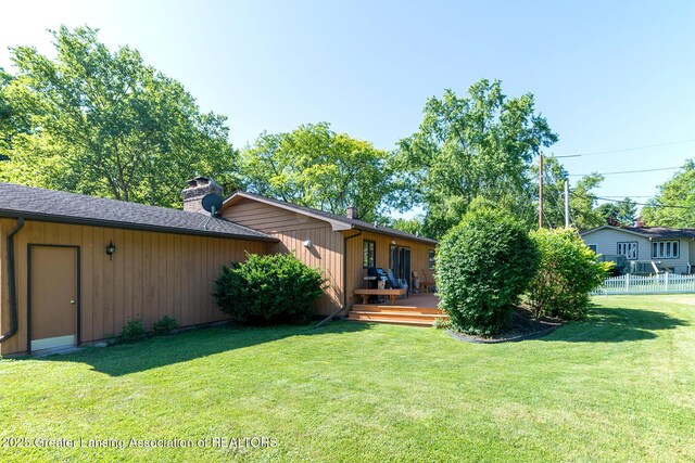 3855 Sandlewood Dr, Okemos, MI 48864 - rear view of house with a chimney and a deck