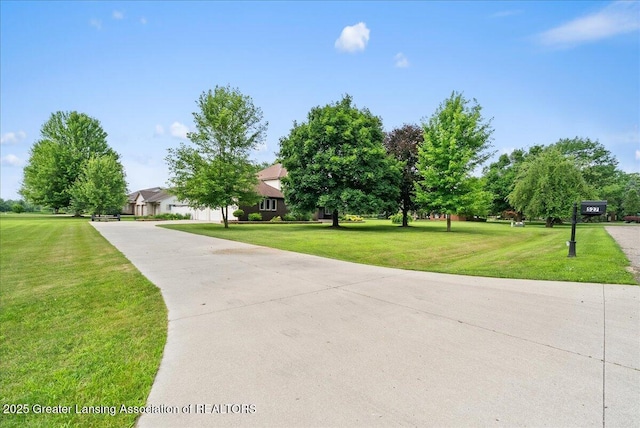 527 Day Rd, Owosso, MI 48867 - view of community with a lawn and driveway