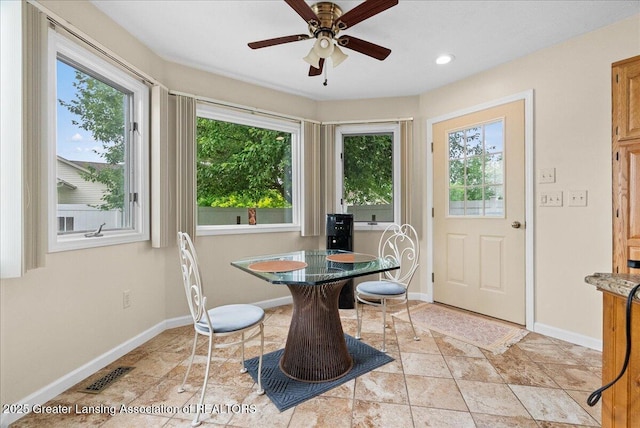 527 Day Rd, Owosso, MI 48867 - dining room with plenty of natural light, ceiling fan, light stone finish flooring, and recessed lighting