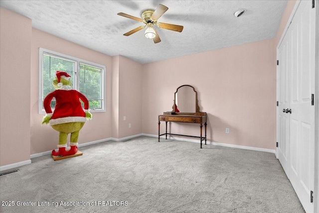 527 Day Rd, Owosso, MI 48867 - interior space with a textured ceiling, carpet, ceiling fan, and a closet