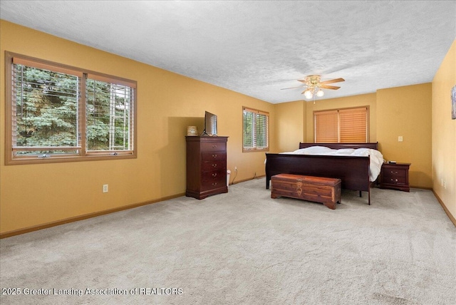 527 Day Rd, Owosso, MI 48867 - bedroom featuring carpet, a textured ceiling, and a ceiling fan