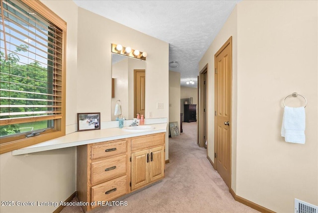 527 Day Rd, Owosso, MI 48867 - bathroom featuring vanity and a textured ceiling