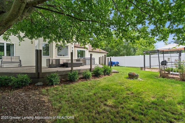 527 Day Rd, Owosso, MI 48867 - fenced backyard with a fire pit, a gazebo, and a deck