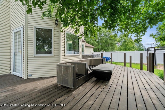 527 Day Rd, Owosso, MI 48867 - deck with an outdoor living space and a fenced backyard