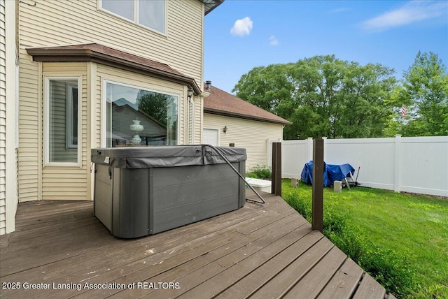 527 Day Rd, Owosso, MI 48867 - wooden deck with a hot tub and a fenced backyard