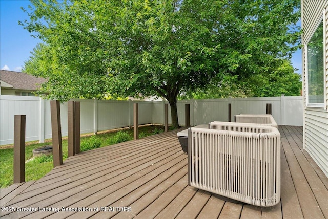 527 Day Rd, Owosso, MI 48867 - wooden terrace with a fenced backyard