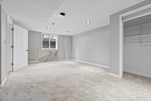 527 Day Rd, Owosso, MI 48867 - unfurnished bedroom featuring carpet flooring, a closet, and recessed lighting