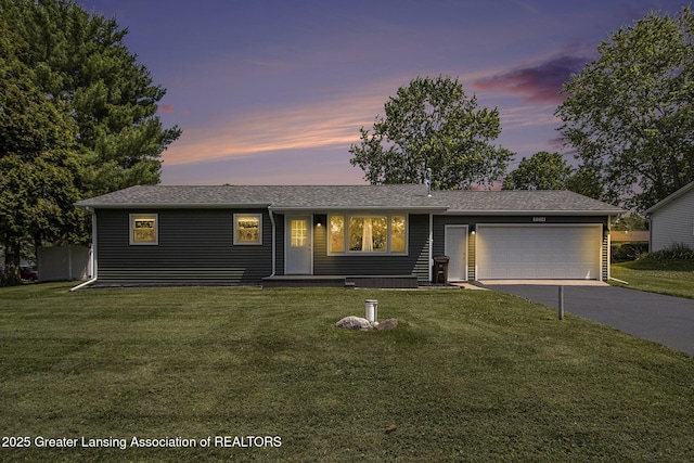 9514 Huntington Rd, Battle Creek, MI 49017 - ranch-style home featuring concrete driveway, an attached garage, and a yard