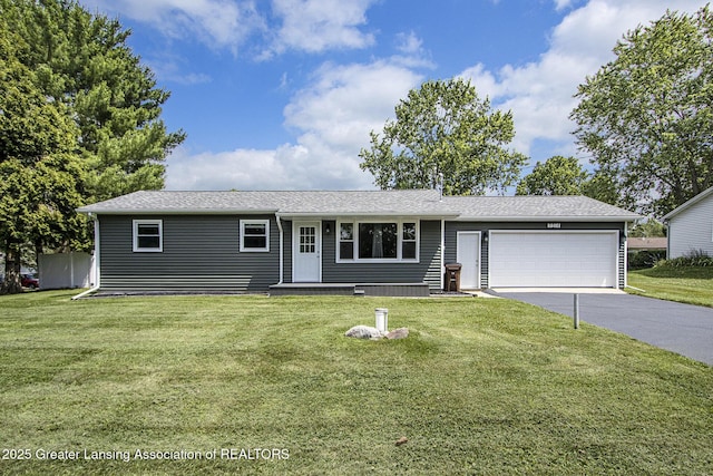 9514 Huntington Rd, Battle Creek, MI 49017 - ranch-style house featuring driveway, a garage, and a front lawn