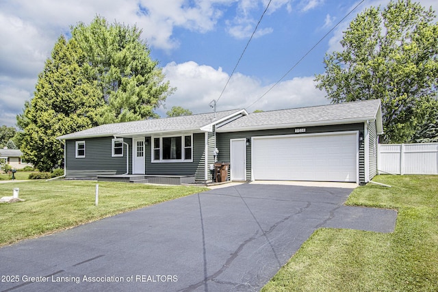 9514 Huntington Rd, Battle Creek, MI 49017 - ranch-style home with driveway, an attached garage, and roof with shingles