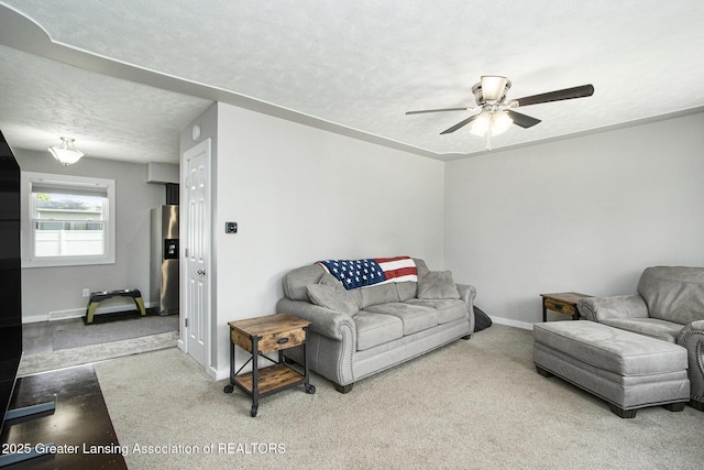 9514 Huntington Rd, Battle Creek, MI 49017 - carpeted living room featuring ceiling fan and a textured ceiling