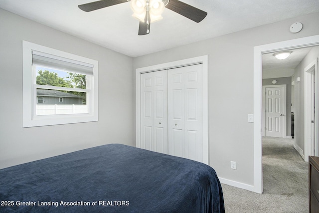 9514 Huntington Rd, Battle Creek, MI 49017 - carpeted bedroom with a closet and a ceiling fan