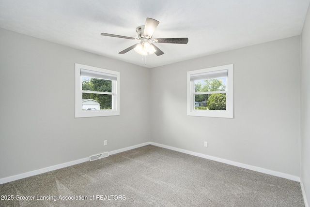 9514 Huntington Rd, Battle Creek, MI 49017 - carpeted empty room with healthy amount of natural light and ceiling fan