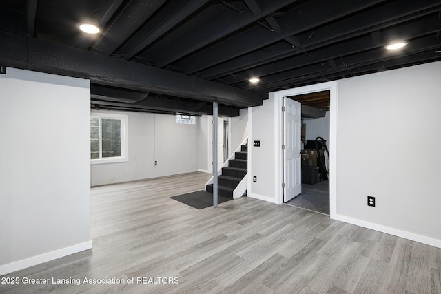 9514 Huntington Rd, Battle Creek, MI 49017 - basement with stairway and wood finished floors