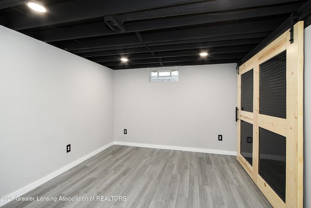 9514 Huntington Rd, Battle Creek, MI 49017 - basement featuring wood finished floors and baseboards