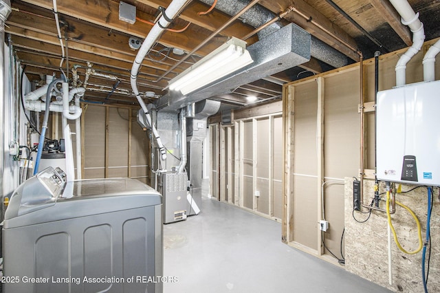 9514 Huntington Rd, Battle Creek, MI 49017 - unfinished basement featuring tankless water heater, heating unit, and washing machine and clothes dryer