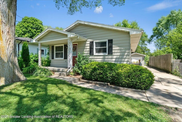 2218 Coolridge Rd, Holt, MI 48842 - bungalow-style home with a porch