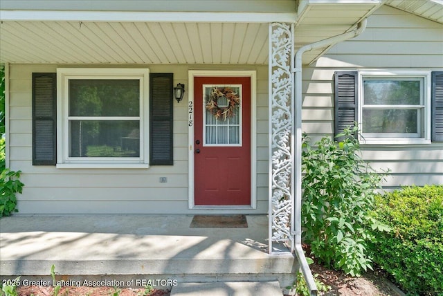 2218 Coolridge Rd, Holt, MI 48842 - doorway to property featuring covered porch