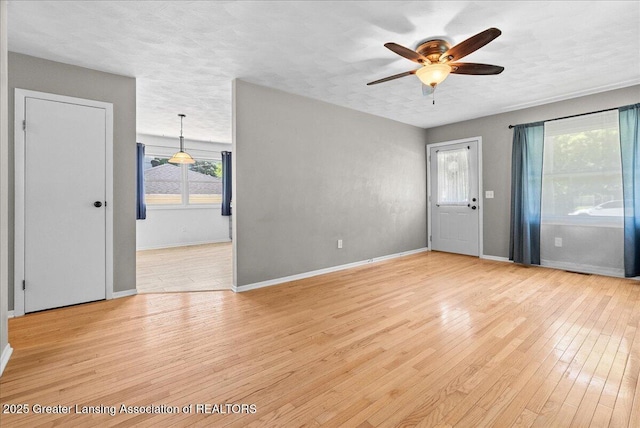 2218 Coolridge Rd, Holt, MI 48842 - unfurnished room with a ceiling fan and light wood finished floors