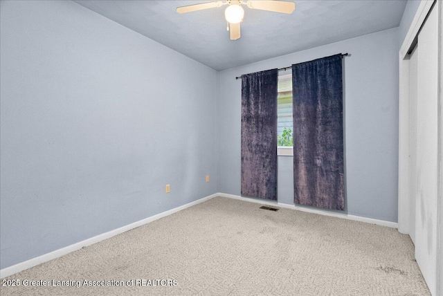2218 Coolridge Rd, Holt, MI 48842 - carpeted empty room featuring a ceiling fan and baseboards