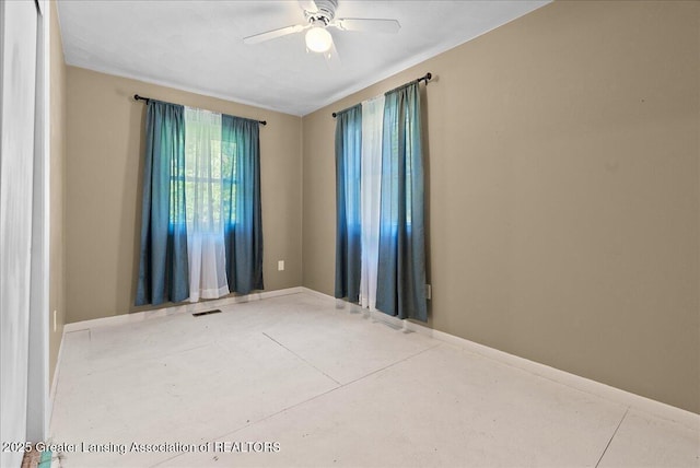 2218 Coolridge Rd, Holt, MI 48842 - empty room featuring concrete flooring and a ceiling fan