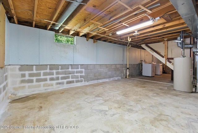 2218 Coolridge Rd, Holt, MI 48842 - below grade area featuring water heater and independent washer and dryer