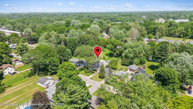2218 Coolridge Rd, Holt, MI 48842 - aerial view of property's location featuring a forest and nearby suburban area