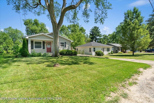 2218 Coolridge Rd, Holt, MI 48842 - ranch-style home featuring a front lawn