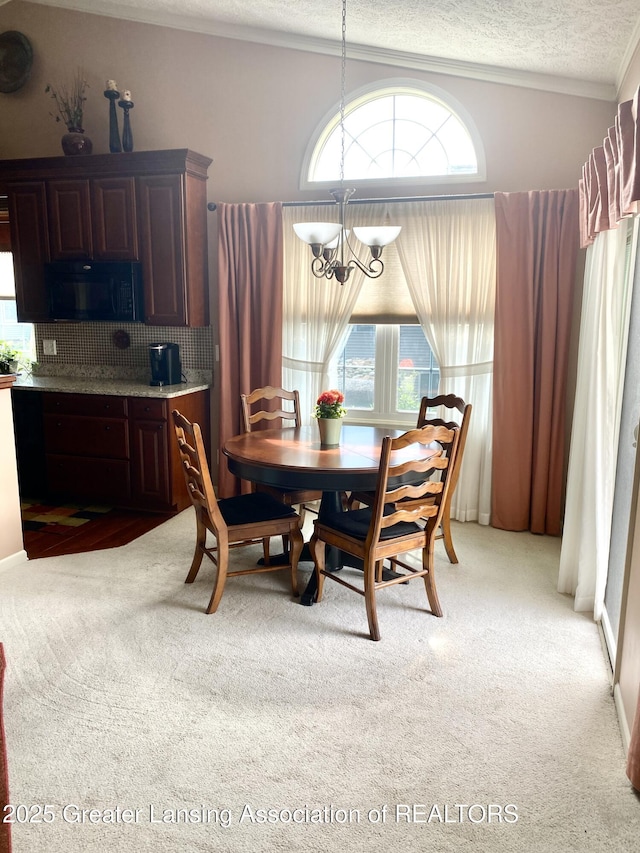4001 Canyon Cv # 56, Holt, MI 48842 - dining area with a chandelier, light carpet, a textured ceiling, and ornamental molding