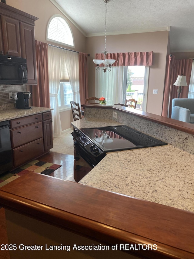 4001 Canyon Cv # 56, Holt, MI 48842 - kitchen with black appliances, vaulted ceiling, a chandelier, ornamental molding, and a textured ceiling